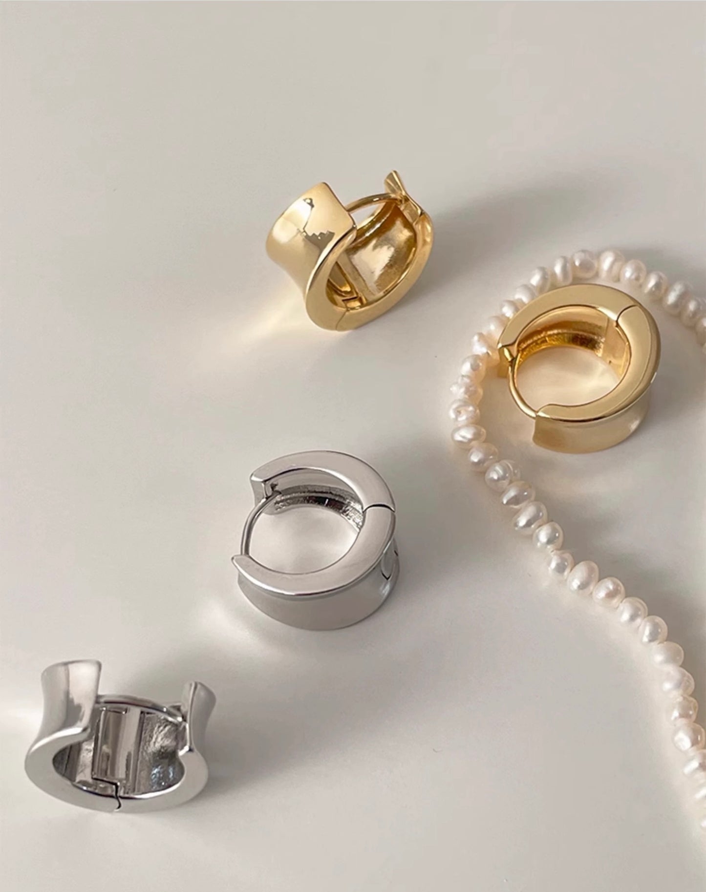 Bold Huggie Hoop Clip-On Earrings in Gold and silver
