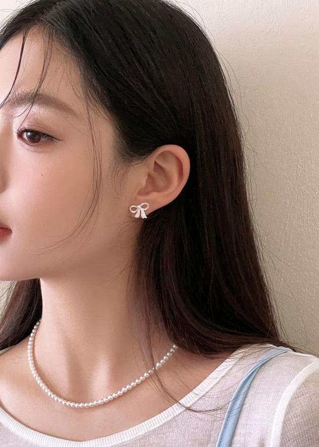 model wearing Bow Knot Earrings